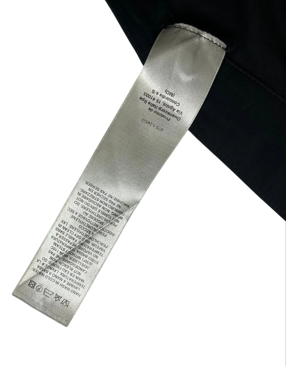Textile tag on a garment with visible brand name